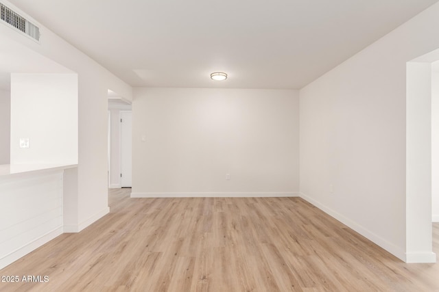 10750 W Abbott Ave, Sun City, AZ 85351 - empty room with light wood-style floors, visible vents, and baseboards