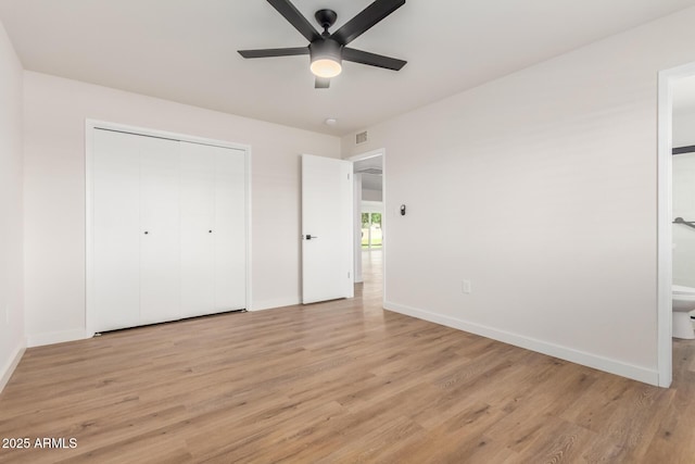 10750 W Abbott Ave, Sun City, AZ 85351 - unfurnished bedroom featuring light wood-style flooring, visible vents, and baseboards
