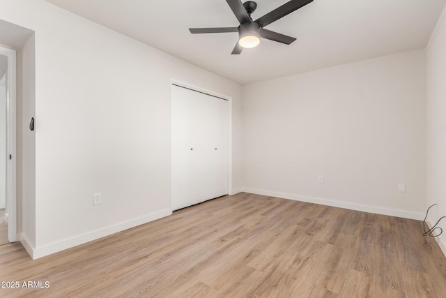 10750 W Abbott Ave, Sun City, AZ 85351 - unfurnished bedroom with light wood-style floors and baseboards
