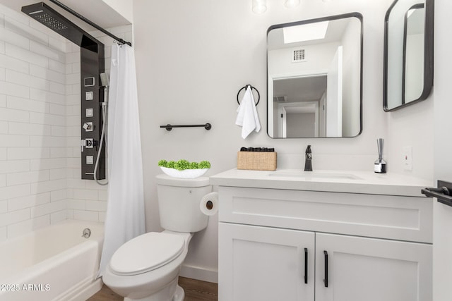 10750 W Abbott Ave, Sun City, AZ 85351 - bathroom with shower / bath combination with curtain, visible vents, vanity, and toilet