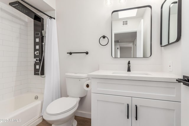 10750 W Abbott Ave, Sun City, AZ 85351 - bathroom with visible vents, shower / bath combination with curtain, vanity, and toilet