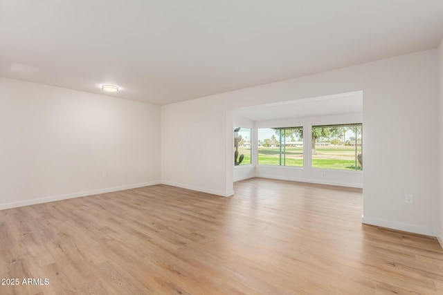 10750 W Abbott Ave, Sun City, AZ 85351 - unfurnished room with light wood-style floors and baseboards