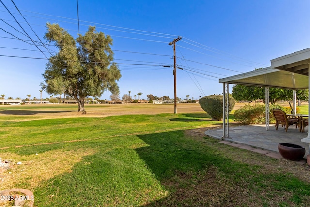 10750 W Abbott Ave, Sun City, AZ 85351 - view of yard featuring a patio area