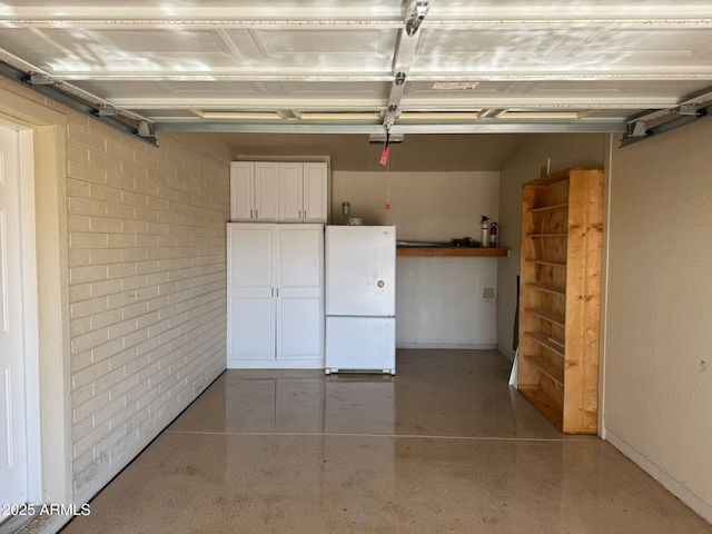 10750 W Abbott Ave, Sun City, AZ 85351 - garage with freestanding refrigerator