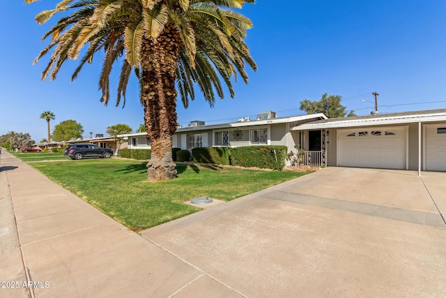 10750 W Abbott Ave, Sun City, AZ 85351 - ranch-style house with a garage, driveway, and a front yard