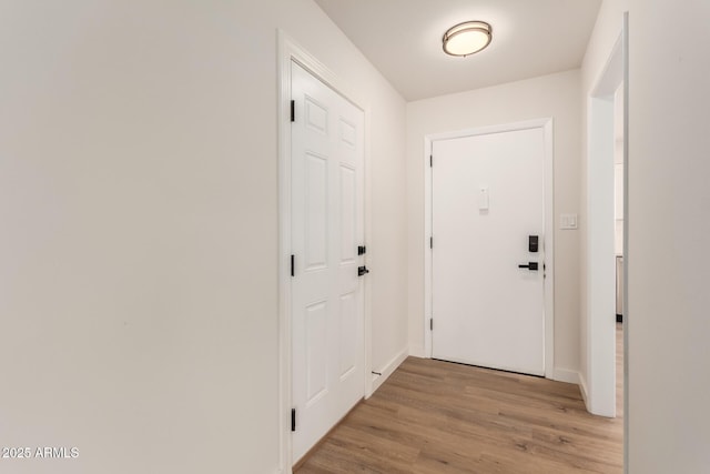 10750 W Abbott Ave, Sun City, AZ 85351 - entryway with light wood-style flooring and baseboards