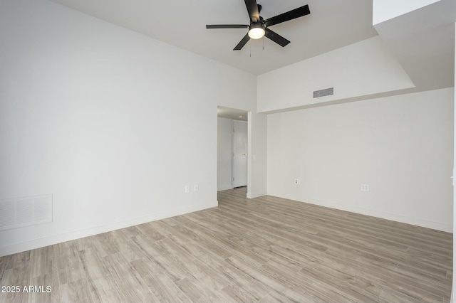 unfurnished room featuring lofted ceiling, light hardwood / wood-style flooring, and ceiling fan