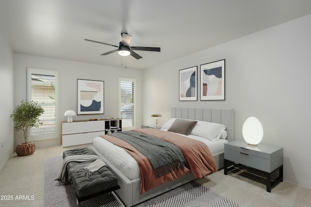 bedroom featuring multiple windows, light carpet, and ceiling fan