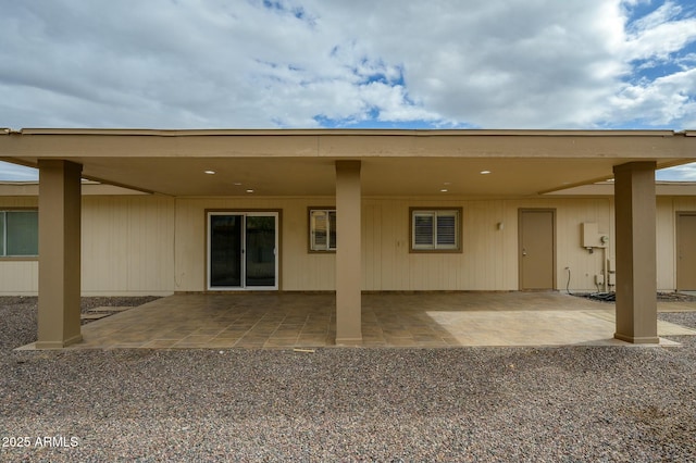 back of property featuring a patio area