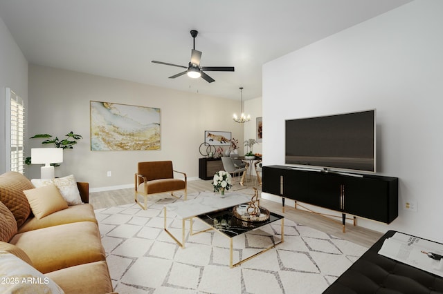 living room featuring hardwood / wood-style floors and ceiling fan with notable chandelier