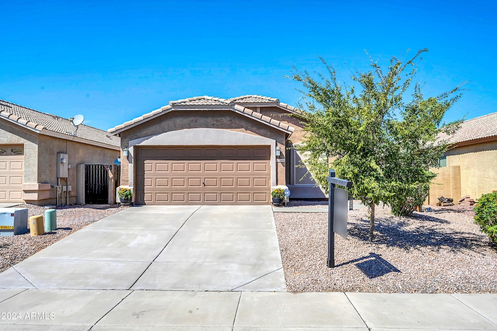 ranch-style home with a garage