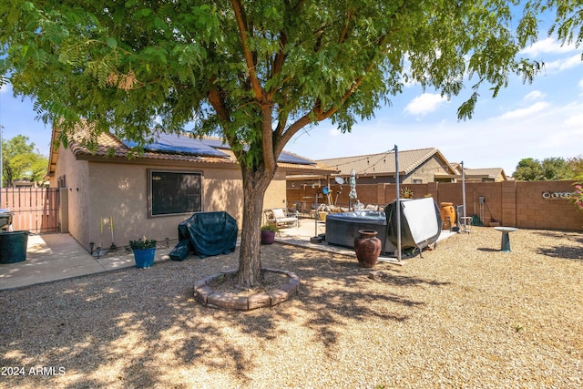 rear view of property featuring a patio area