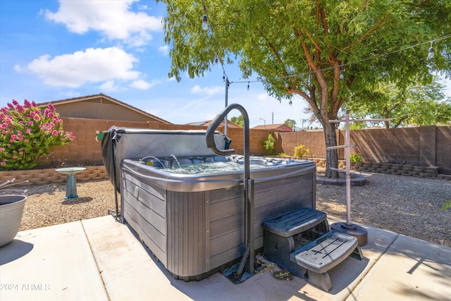 view of patio with a hot tub