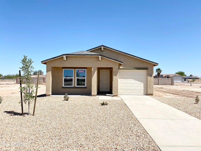 single story home featuring a garage