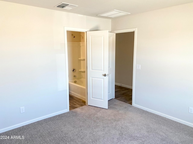 unfurnished bedroom with carpet and ensuite bath