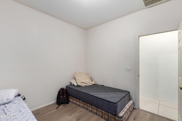 bedroom featuring light hardwood / wood-style floors