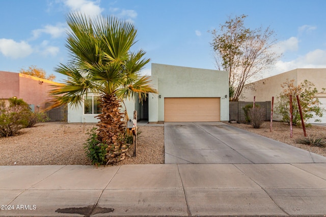 southwest-style home with a garage