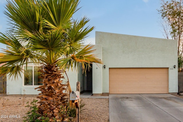 view of front of property with a garage