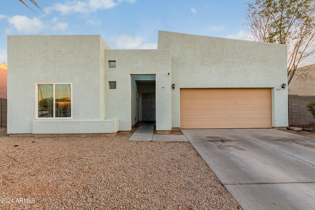 adobe home featuring a garage