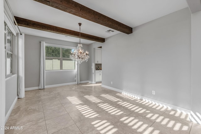 unfurnished room with a chandelier, beam ceiling, and light tile patterned floors