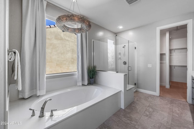 bathroom with a healthy amount of sunlight and independent shower and bath