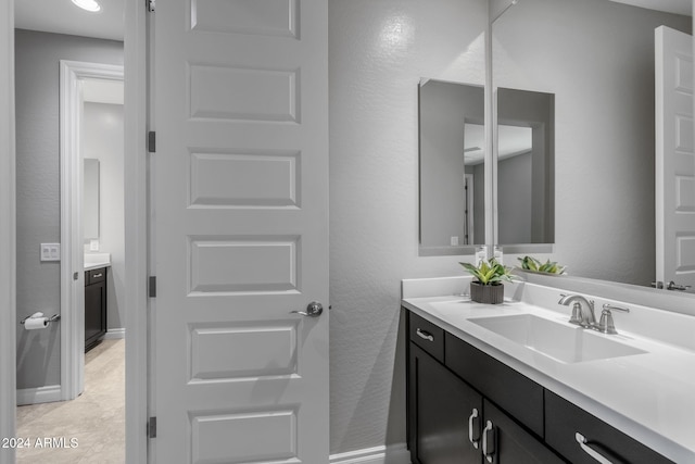 bathroom featuring tile patterned floors and vanity