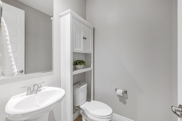 bathroom featuring sink and toilet