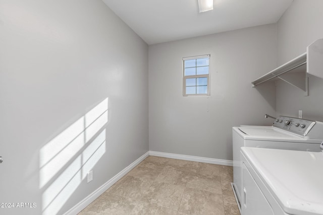 laundry room featuring separate washer and dryer