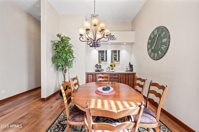 dining room featuring an inviting chandelier and hardwood / wood-style floors