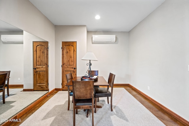 dining area featuring an AC wall unit