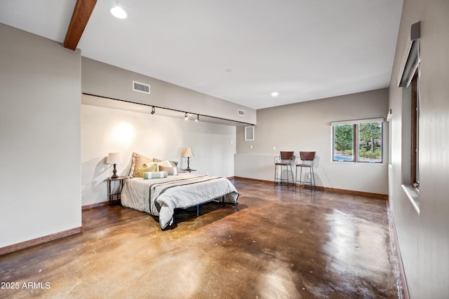 bedroom featuring concrete flooring and beamed ceiling