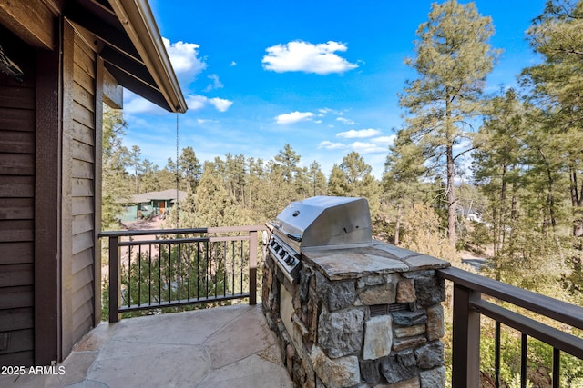 view of patio / terrace featuring a balcony and area for grilling