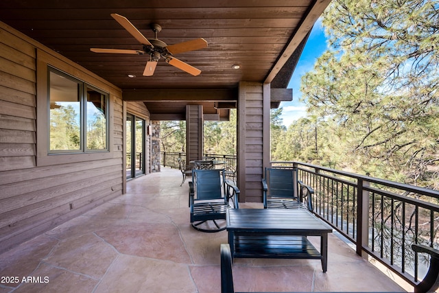 view of patio / terrace featuring a balcony and ceiling fan