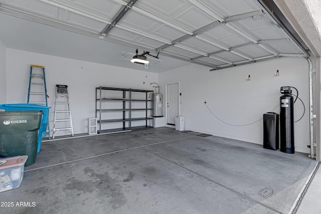 garage with a garage door opener and water heater