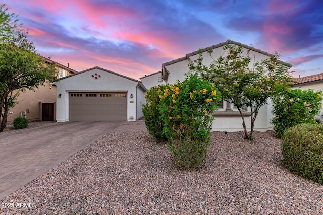3884 S Wilson Dr, Chandler, AZ 85286 - view of front of property featuring decorative driveway, a garage, stucco siding, and a tiled roof