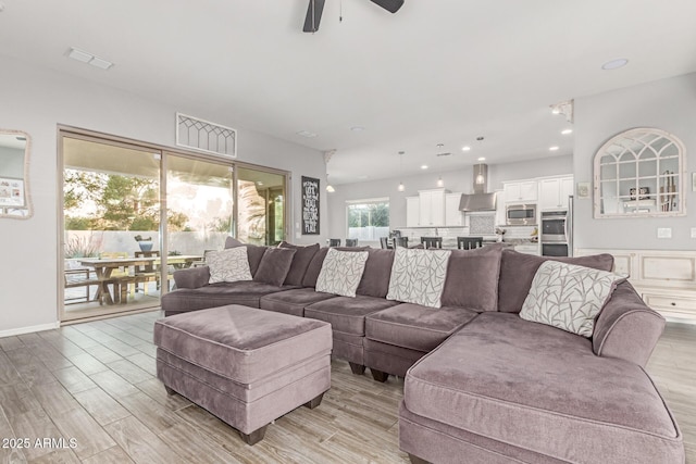 3884 S Wilson Dr, Chandler, AZ 85286 - living area with ceiling fan, light wood-style floors, and recessed lighting
