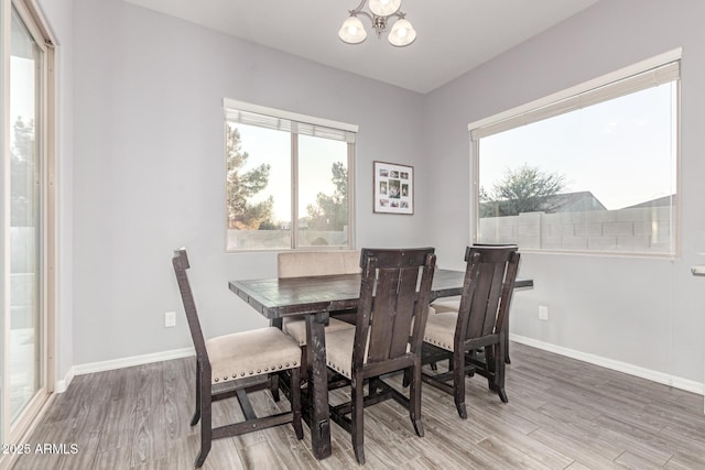 3884 S Wilson Dr, Chandler, AZ 85286 - dining space featuring a chandelier and light wood-style floors