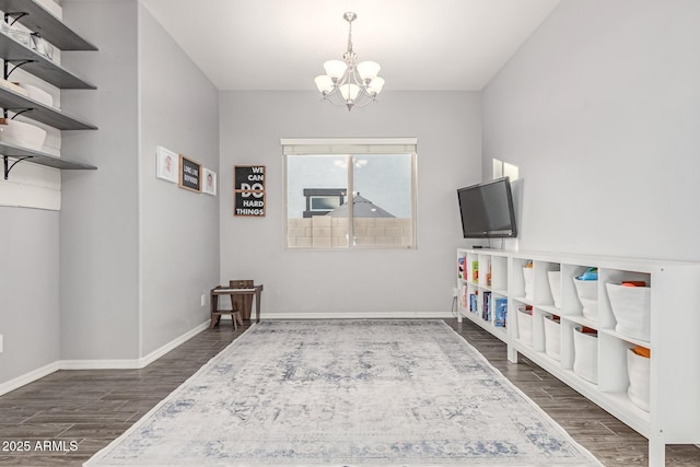 3884 S Wilson Dr, Chandler, AZ 85286 - sitting room with dark wood-style flooring and a chandelier