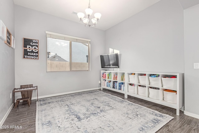 3884 S Wilson Dr, Chandler, AZ 85286 - recreation room featuring a chandelier, wood finished floors, and lofted ceiling