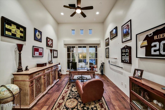 office with ceiling fan, a high ceiling, dark wood finished floors, and recessed lighting