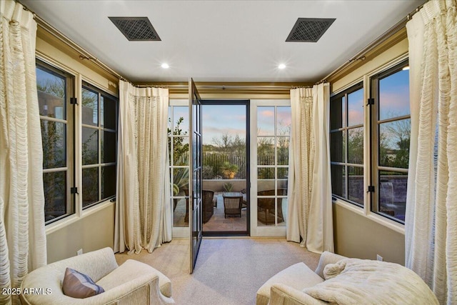 entryway featuring recessed lighting, visible vents, and carpet floors