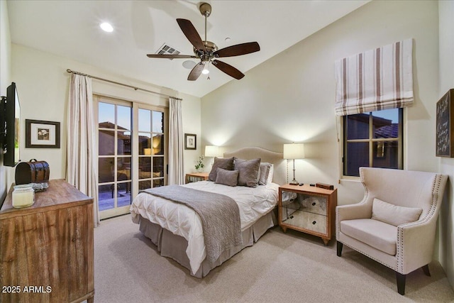 bedroom featuring visible vents, light colored carpet, access to outside, and vaulted ceiling