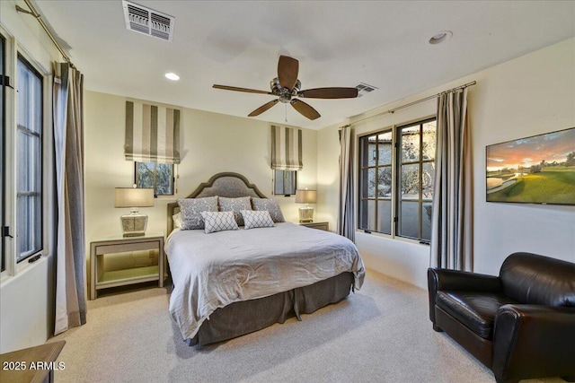 carpeted bedroom featuring recessed lighting, visible vents, and ceiling fan