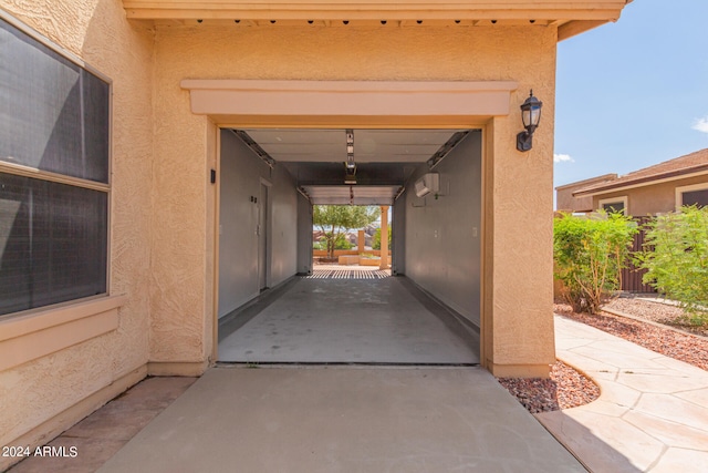 view of exterior entry with a wall mounted AC