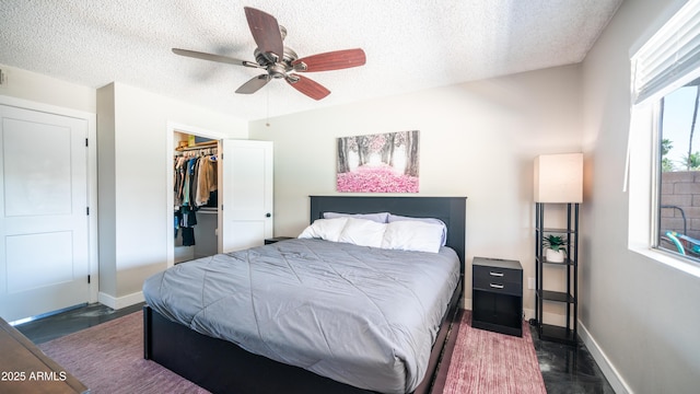 2139 W Obispo Ave, Mesa, AZ 85202 - bedroom with a textured ceiling, baseboards, a ceiling fan, a spacious closet, and a closet