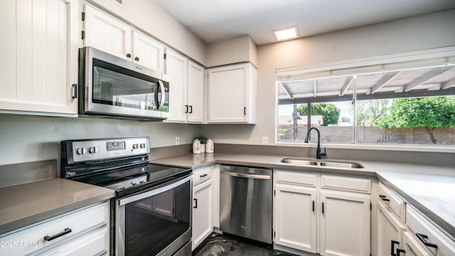 2139 W Obispo Ave, Mesa, AZ 85202 - kitchen featuring appliances with stainless steel finishes, a sink, and white cabinets