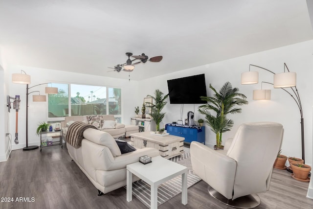 living room featuring ceiling fan and hardwood / wood-style floors