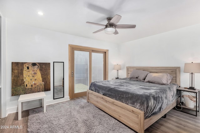 bedroom featuring hardwood / wood-style flooring, ceiling fan, and access to exterior