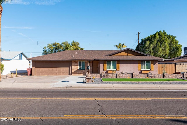 ranch-style home featuring a garage