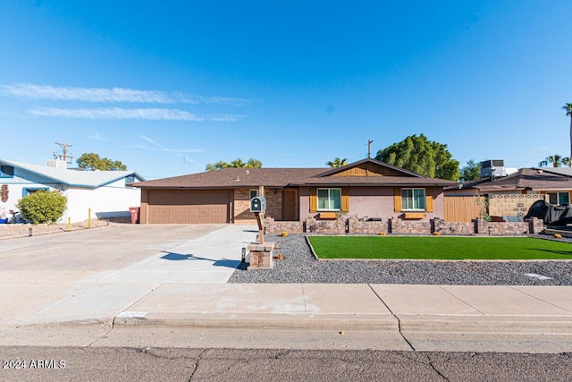 ranch-style house with a front yard and a garage